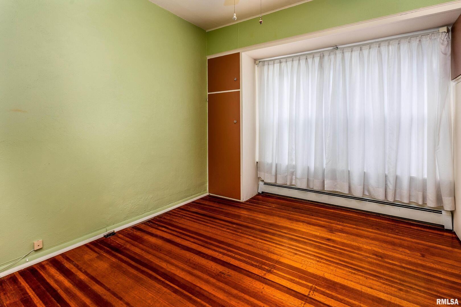 2120 Logan Street Murphysboro, IL 62966 - Photo 21 of 30 a view of a room with wooden floor and a window