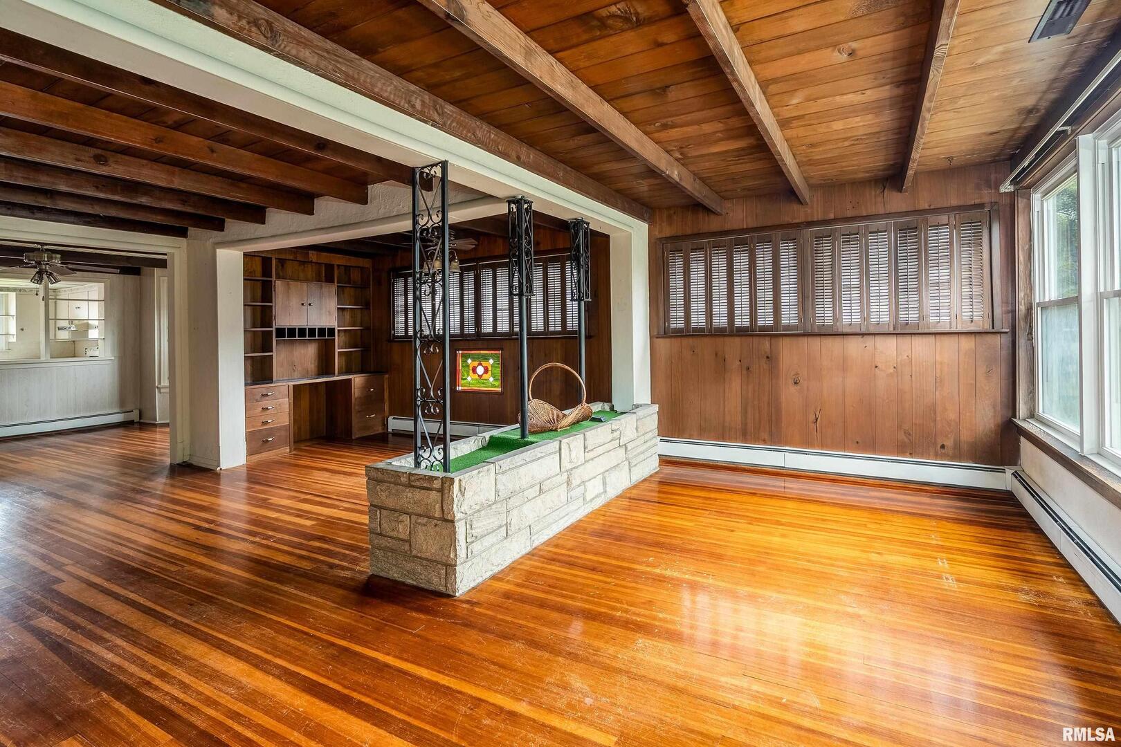 2120 Logan Street Murphysboro, IL 62966 - Photo 4 of 30 a view of an empty room with wooden floor and a window