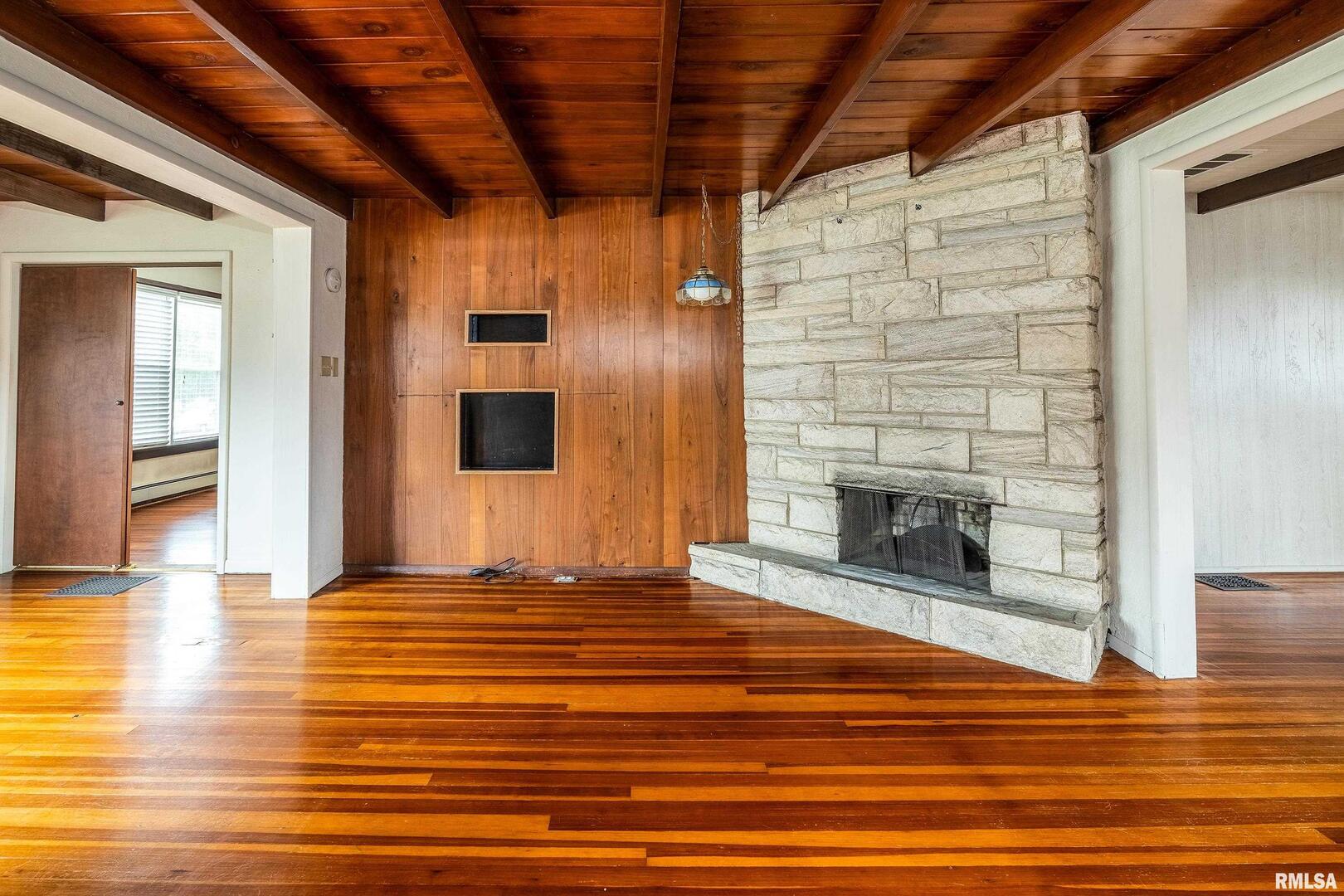 2120 Logan Street Murphysboro, IL 62966 - Photo 8 of 30 a view of a livingroom with wooden floor and a fireplace
