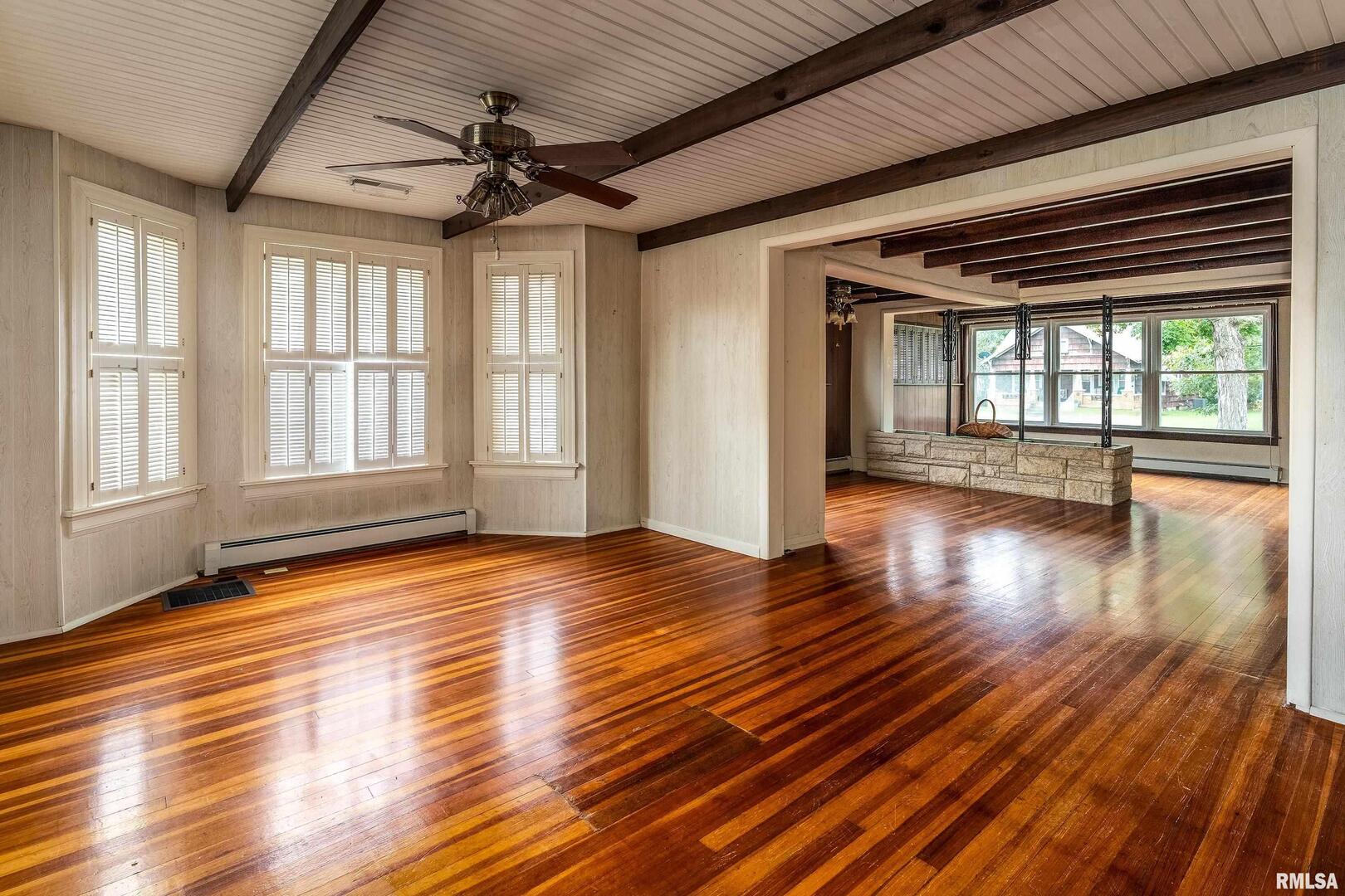 2120 Logan Street Murphysboro, IL 62966 - Photo 10 of 30 a view of an empty room with wooden floor and a window