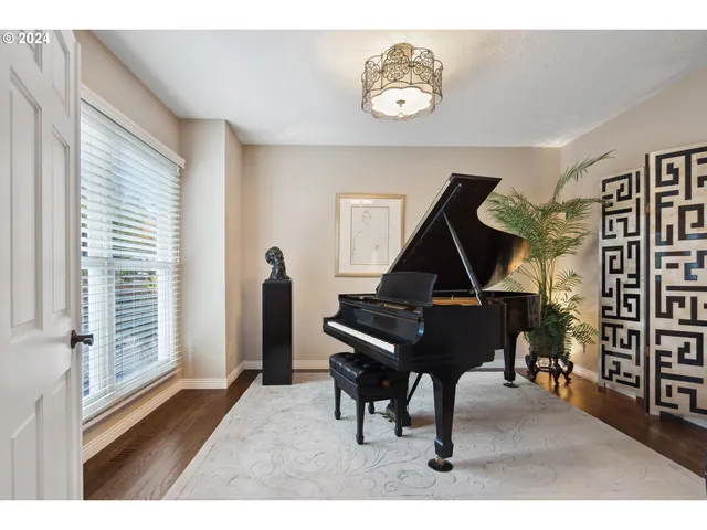 a living room with furniture fireplace and a window