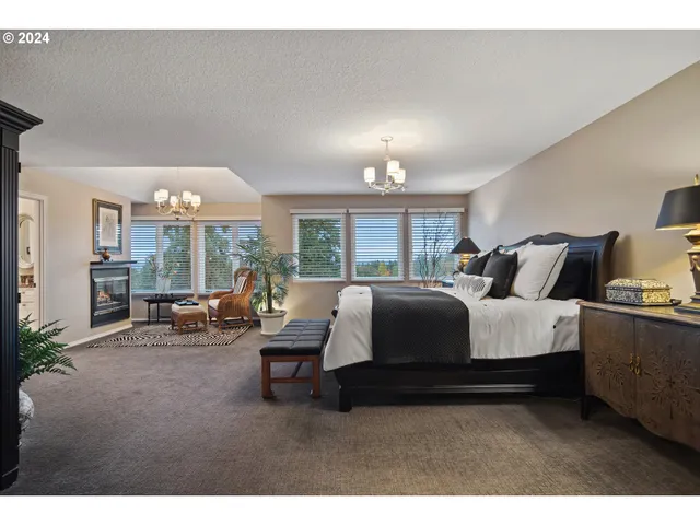 a bed room with a bed and a large window