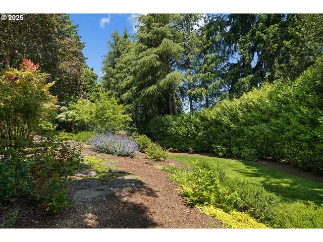 a view of a garden with a building