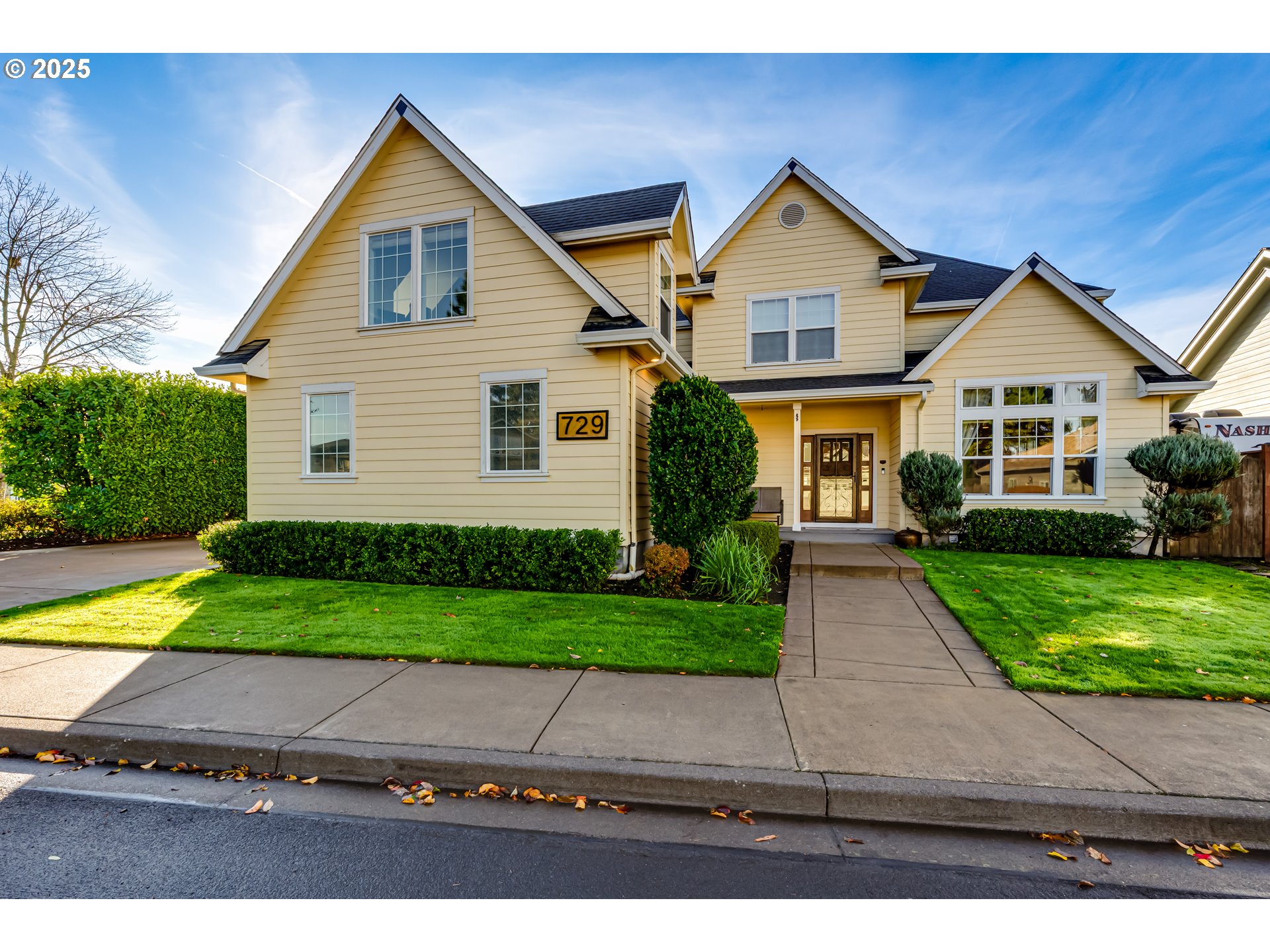 729 Aspen Street Springfield, OR 97477 - Photo 1 of 39 a front view of a house with a yard and garage