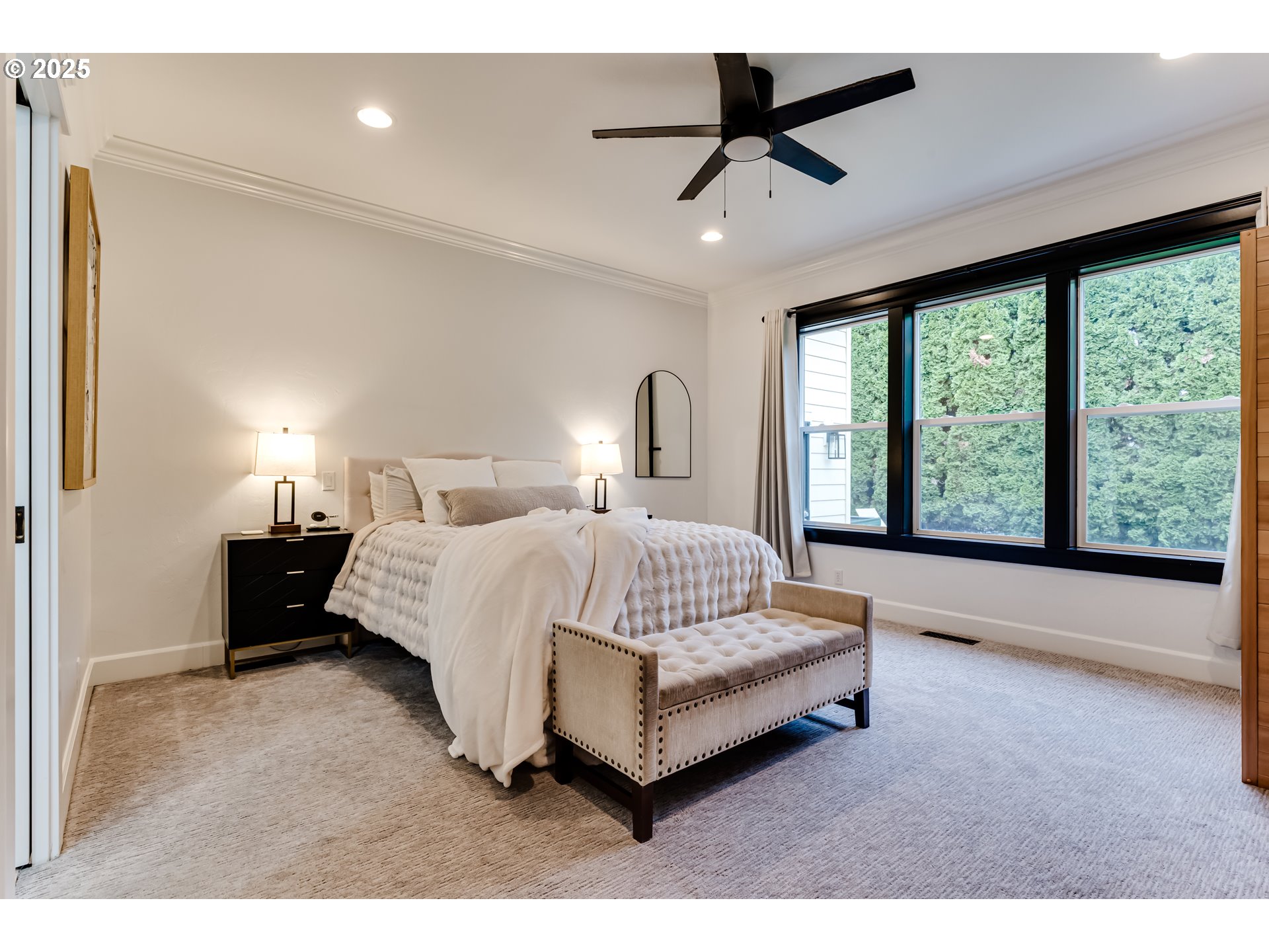 729 Aspen Street Springfield, OR 97477 - Photo 19 of 39 a spacious bedroom with a large bed and a large window
