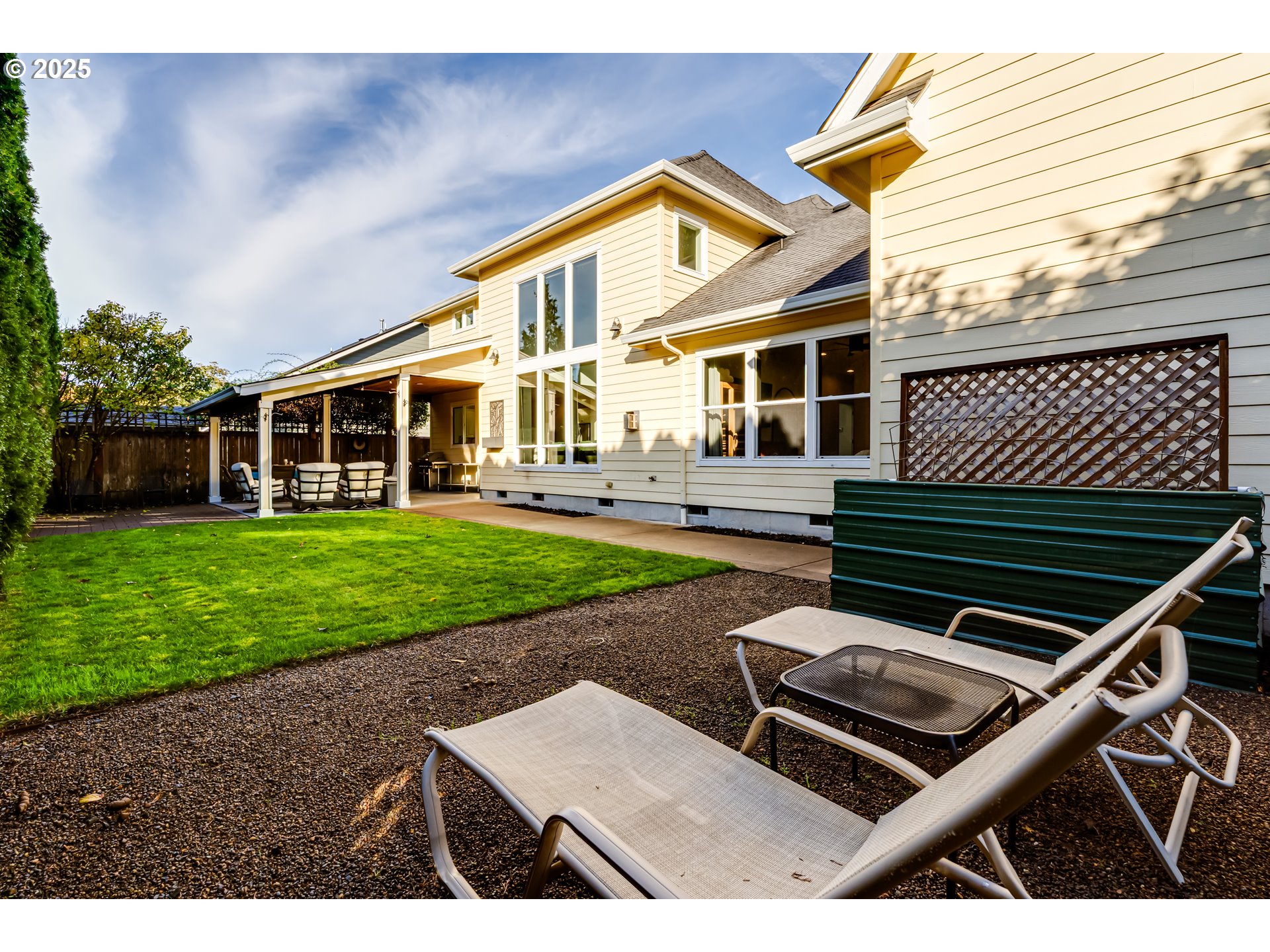 729 Aspen Street Springfield, OR 97477 - Photo 36 of 39 a front view of a house with a yard table and chairs