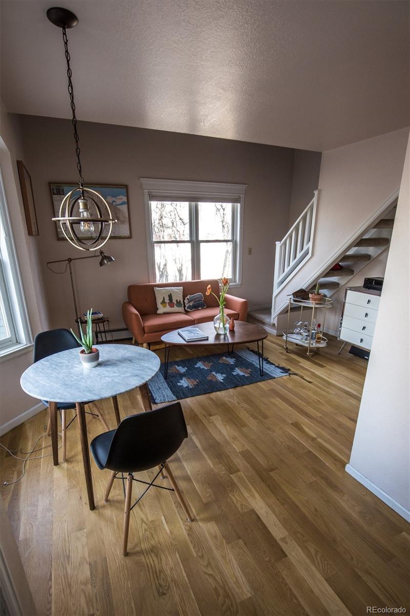 1430 18th Street, Unit 9 Boulder, CO 80302 - Photo 12 of 16 a living room with dining room and kitchen view