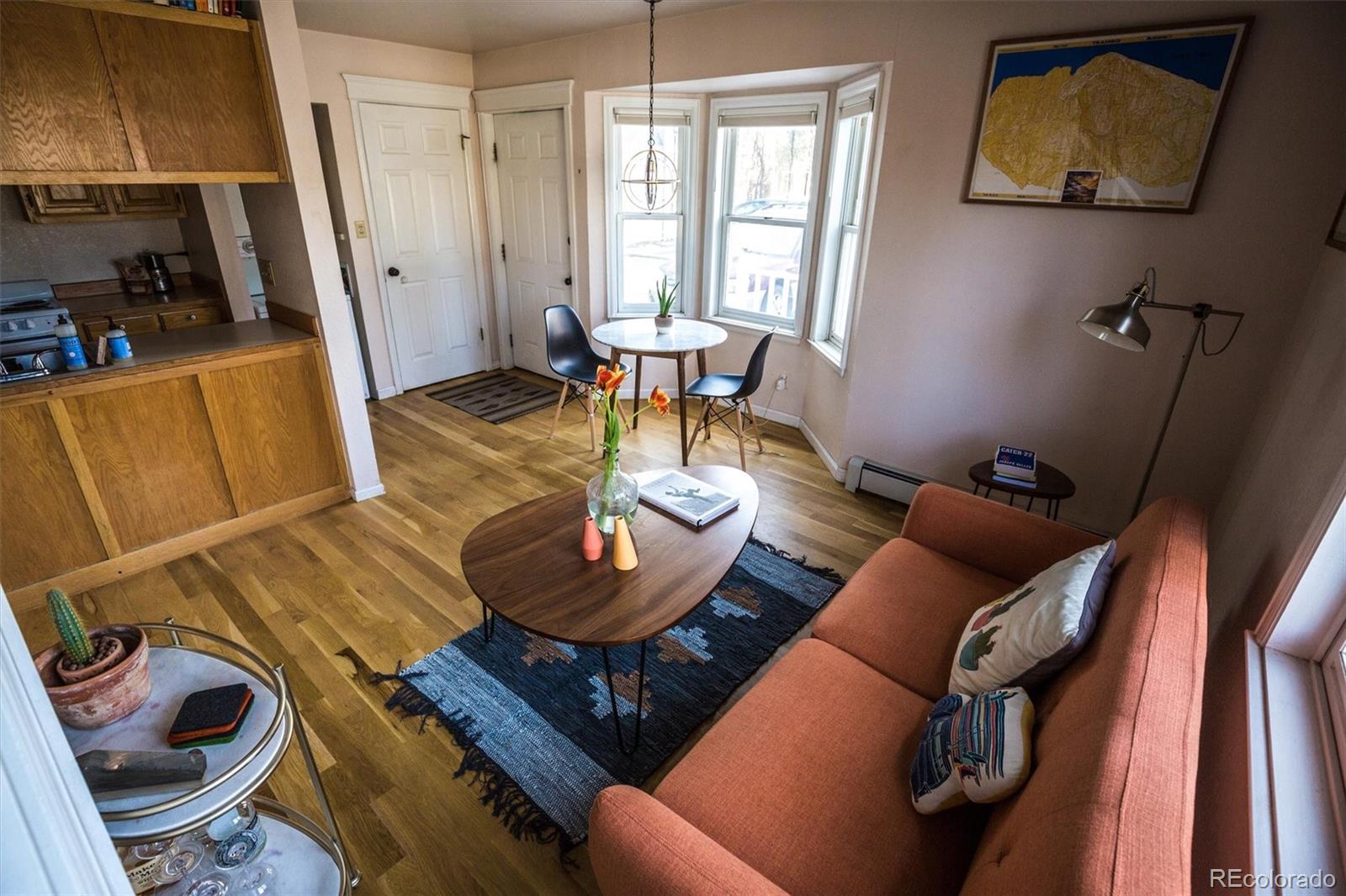 1430 18th Street, Unit 9 Boulder, CO 80302 - Photo 13 of 16 a living room with furniture and wooden floor