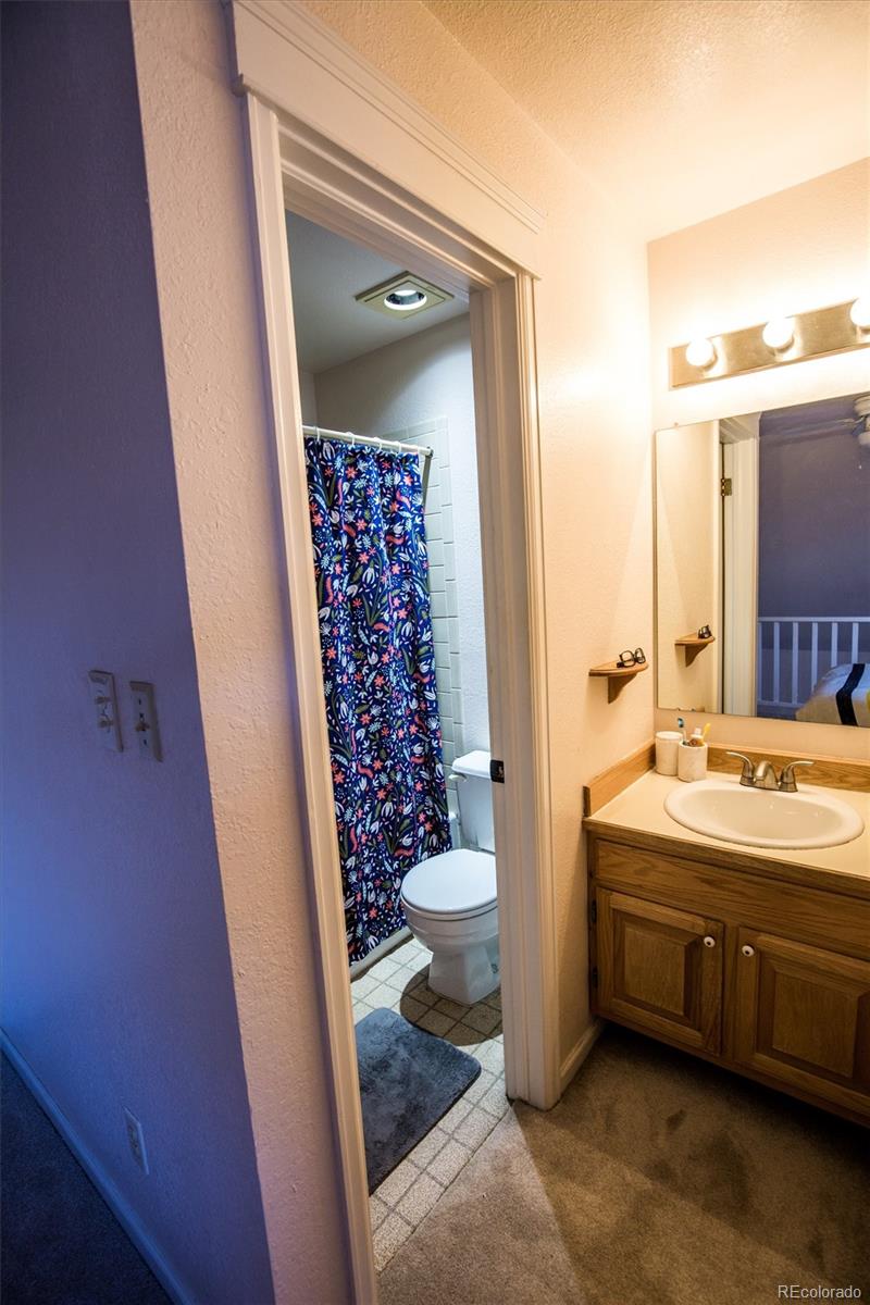 1430 18th Street, Unit 9 Boulder, CO 80302 - Photo 14 of 16 a bathroom with a sink and a mirror