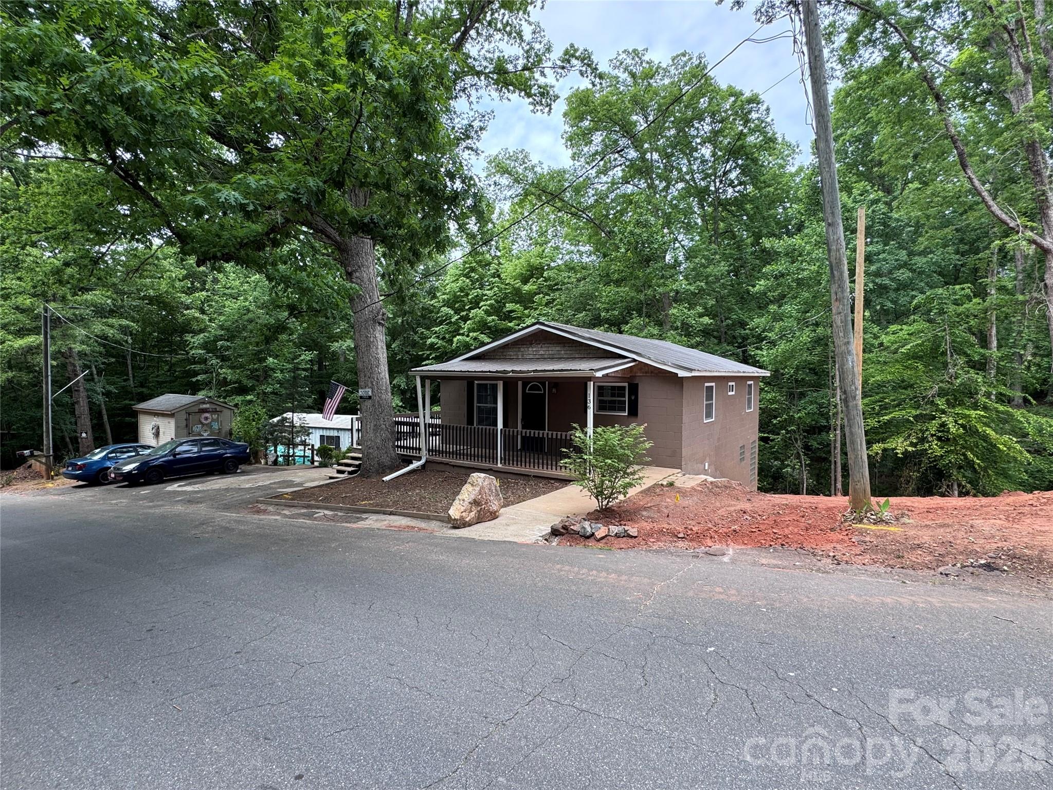 136 St John Zion Road Rutherfordton, NC 28139 - Photo 2 of 29 a front view of a house with a yard and garage