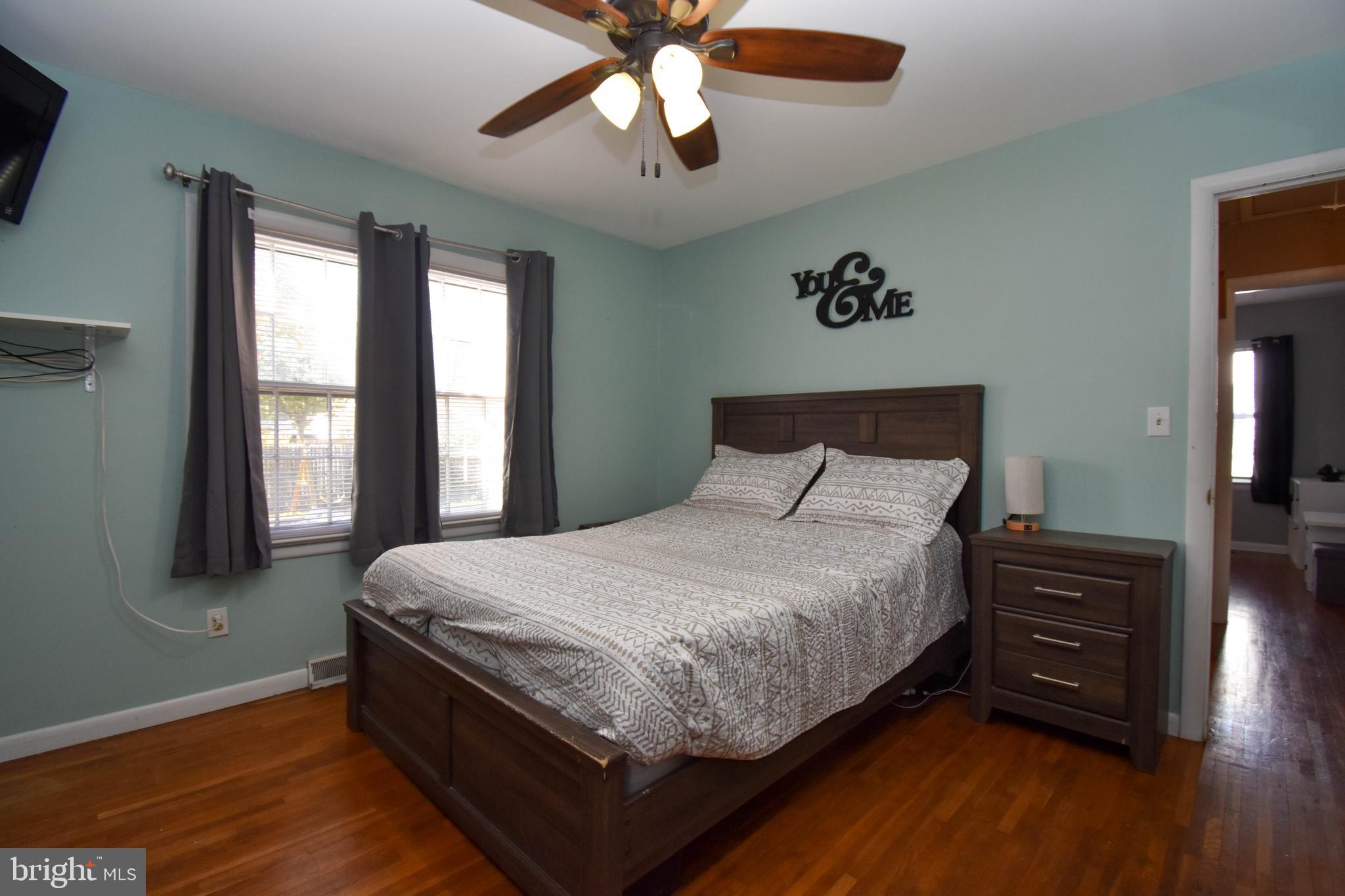 309 Robinson Street Georgetown, DE 19947 - Photo 13 of 26 a bedroom with a bed dresser and a window