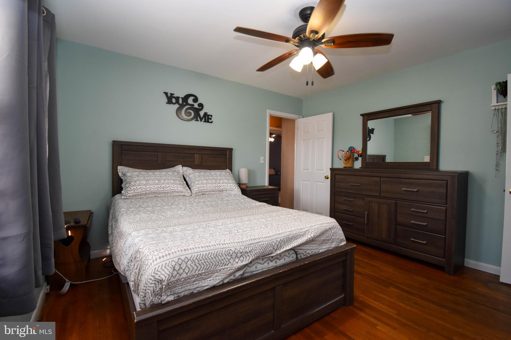 309 Robinson Street Georgetown, DE 19947 - Photo 14 of 26 a bedroom with a bed and a dresser