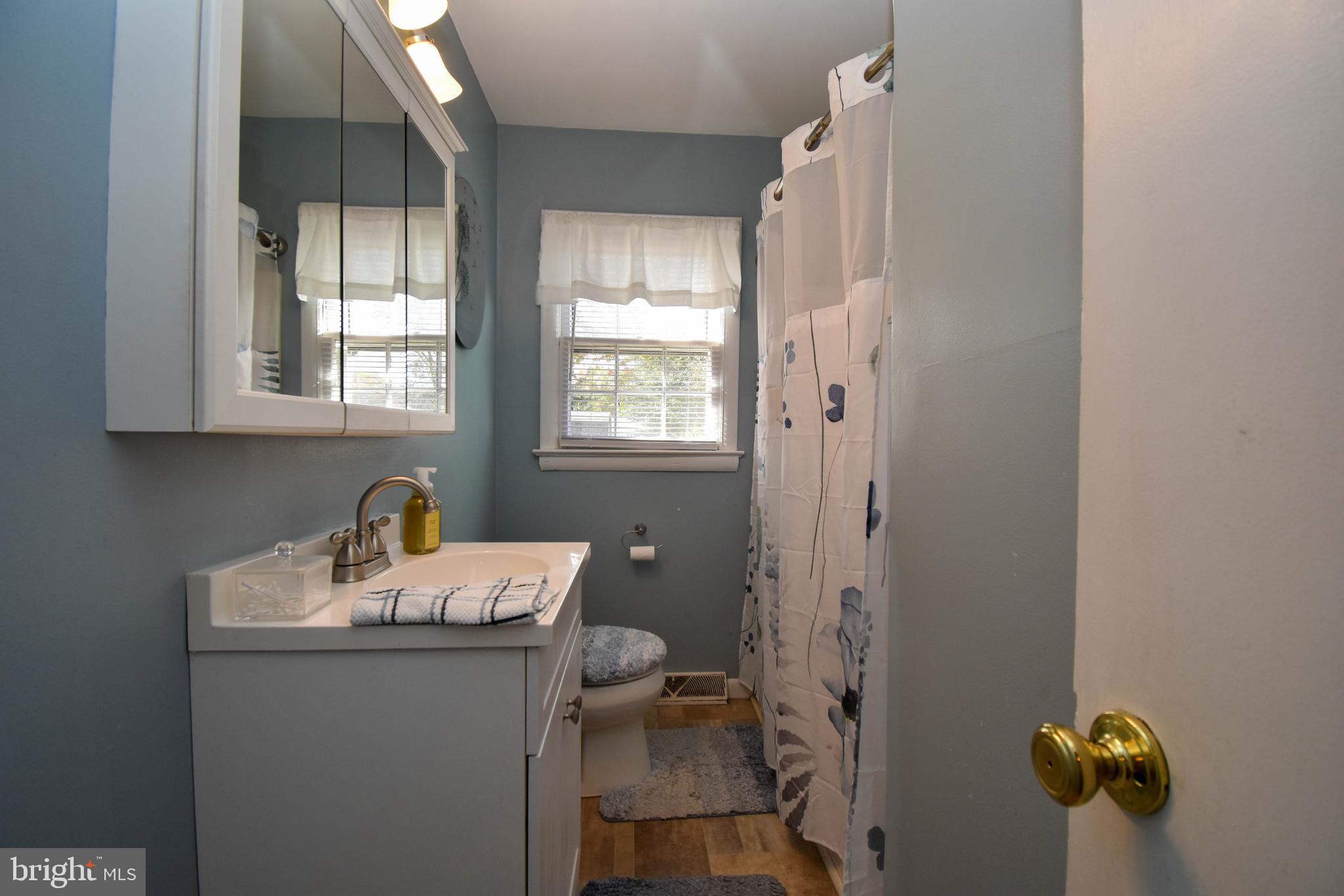 309 Robinson Street Georgetown, DE 19947 - Photo 15 of 26 a room with a window and chandelier