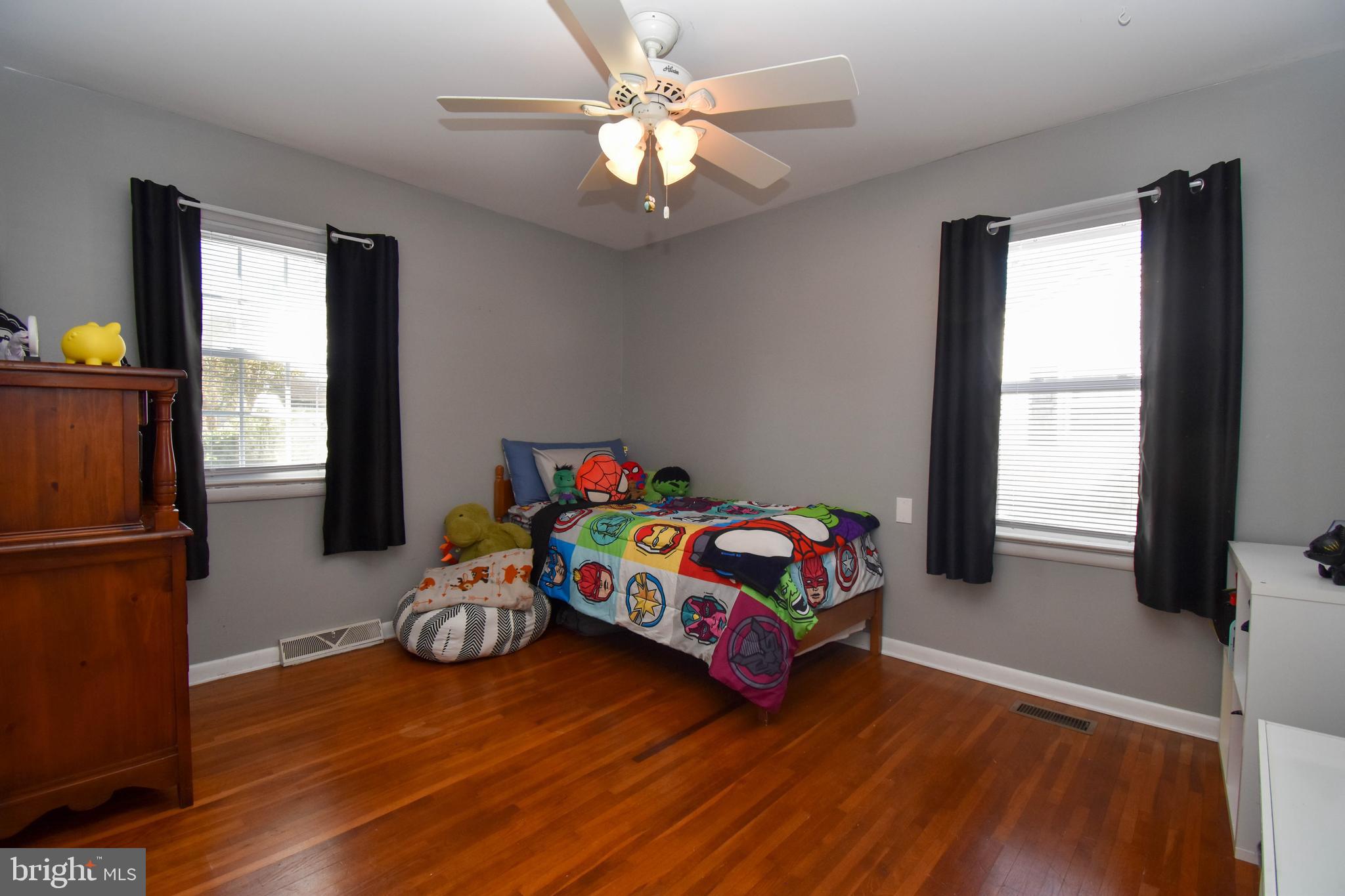 309 Robinson Street Georgetown, DE 19947 - Photo 18 of 26 a bedroom with furniture and a window