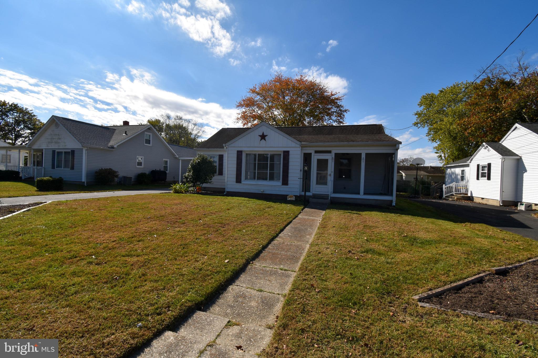 309 Robinson Street Georgetown, DE 19947 - Photo 2 of 26 a front view of a house with a yard
