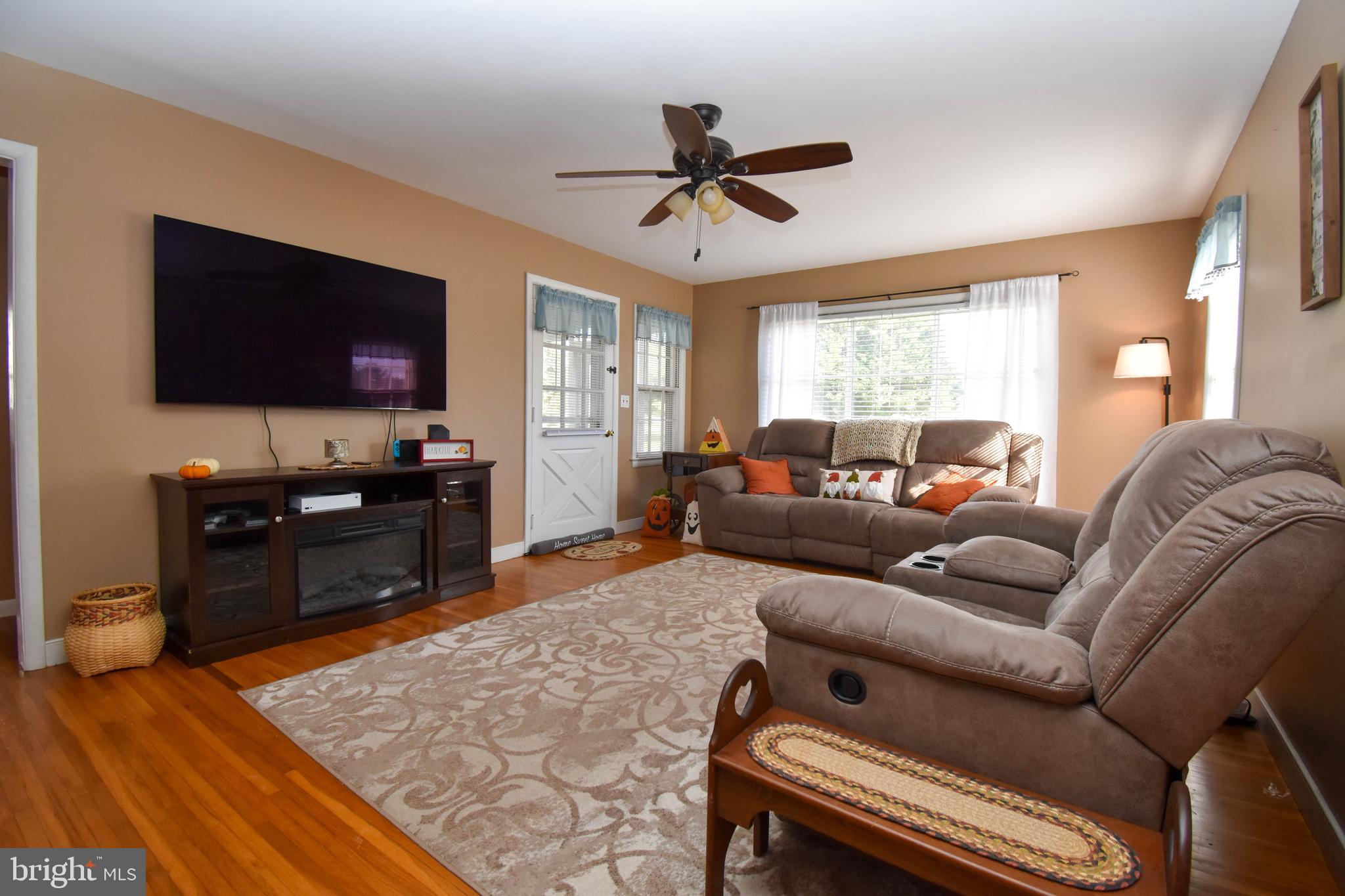 309 Robinson Street Georgetown, DE 19947 - Photo 3 of 26 a living room with furniture and a flat screen tv