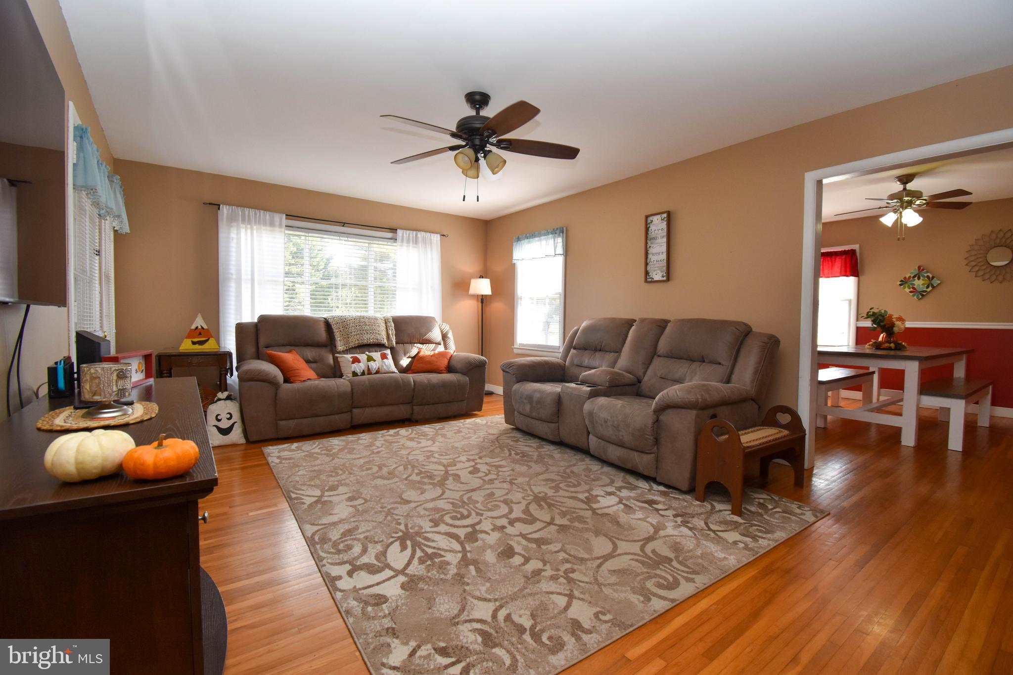 309 Robinson Street Georgetown, DE 19947 - Photo 4 of 26 a living room with furniture and a wooden floor