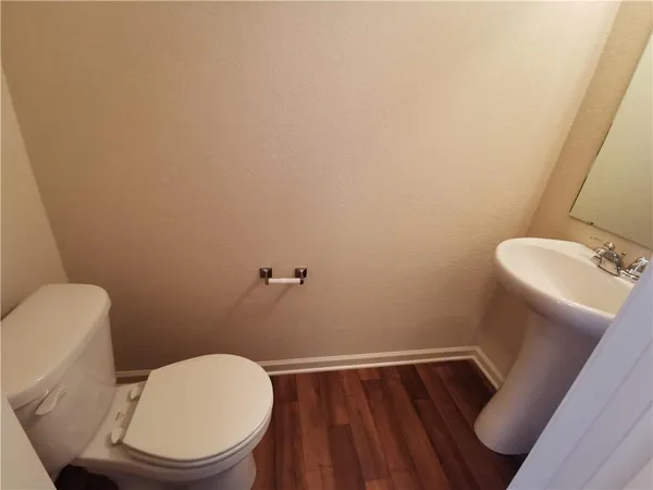 a bathroom with a toilet and a sink