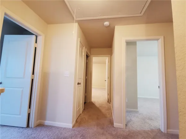 a view of a hallway with closet area