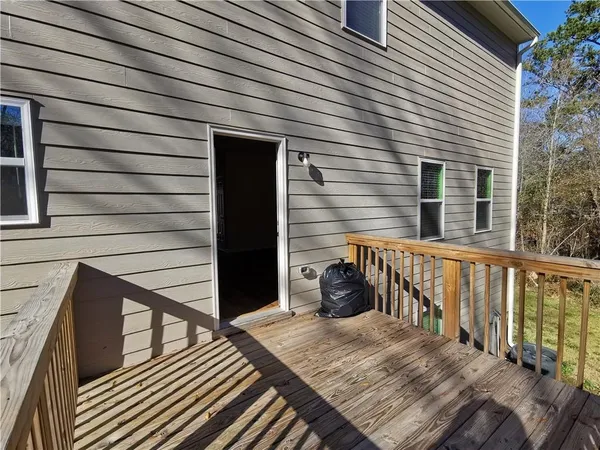 a balcony view with a seating space