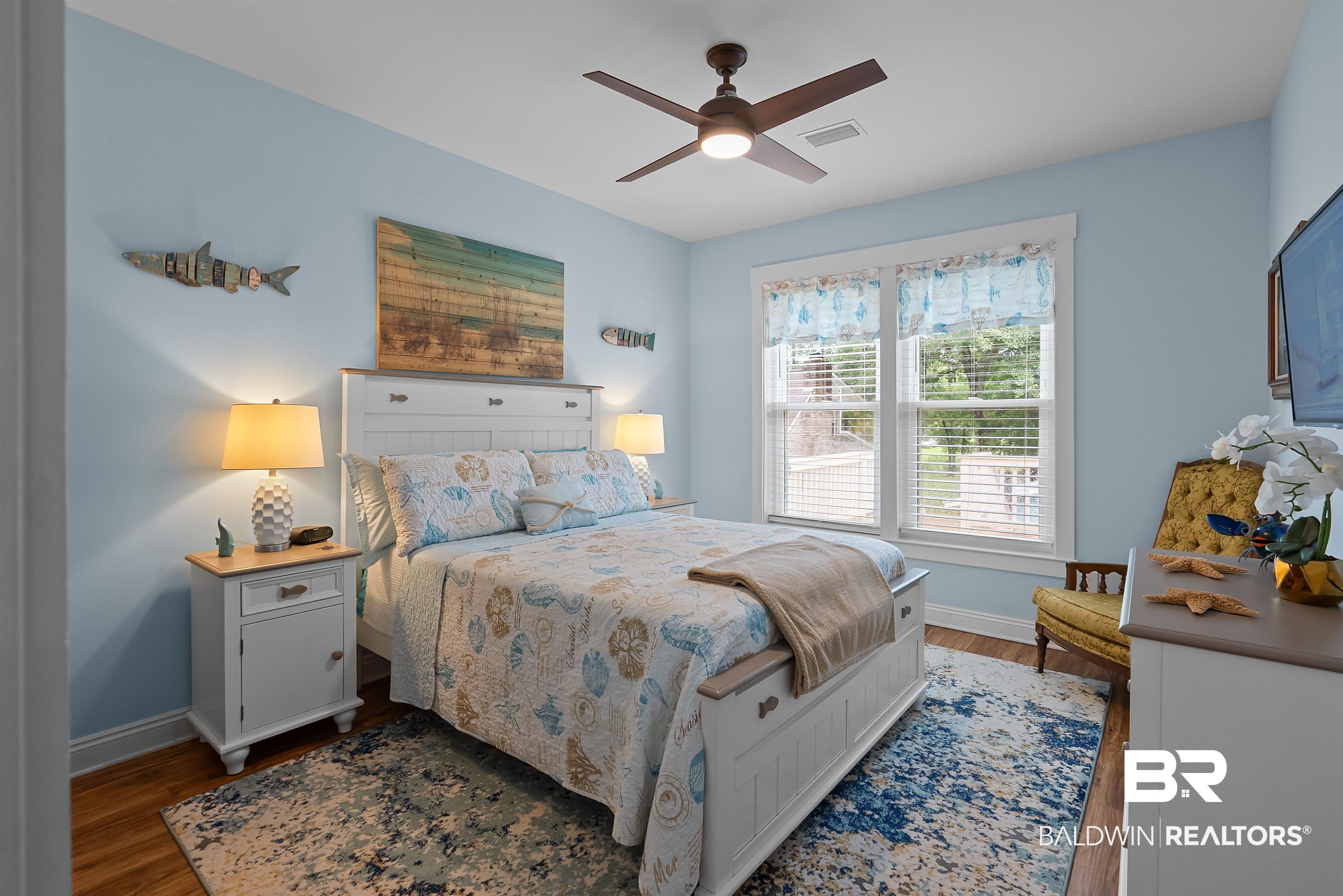7266 Franklin Road Foley, AL 36535 - Photo 29 of 64 Bright bedroom featuring light blue walls and wood-finish flooring