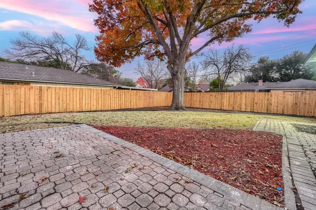 a view of backyard with green space