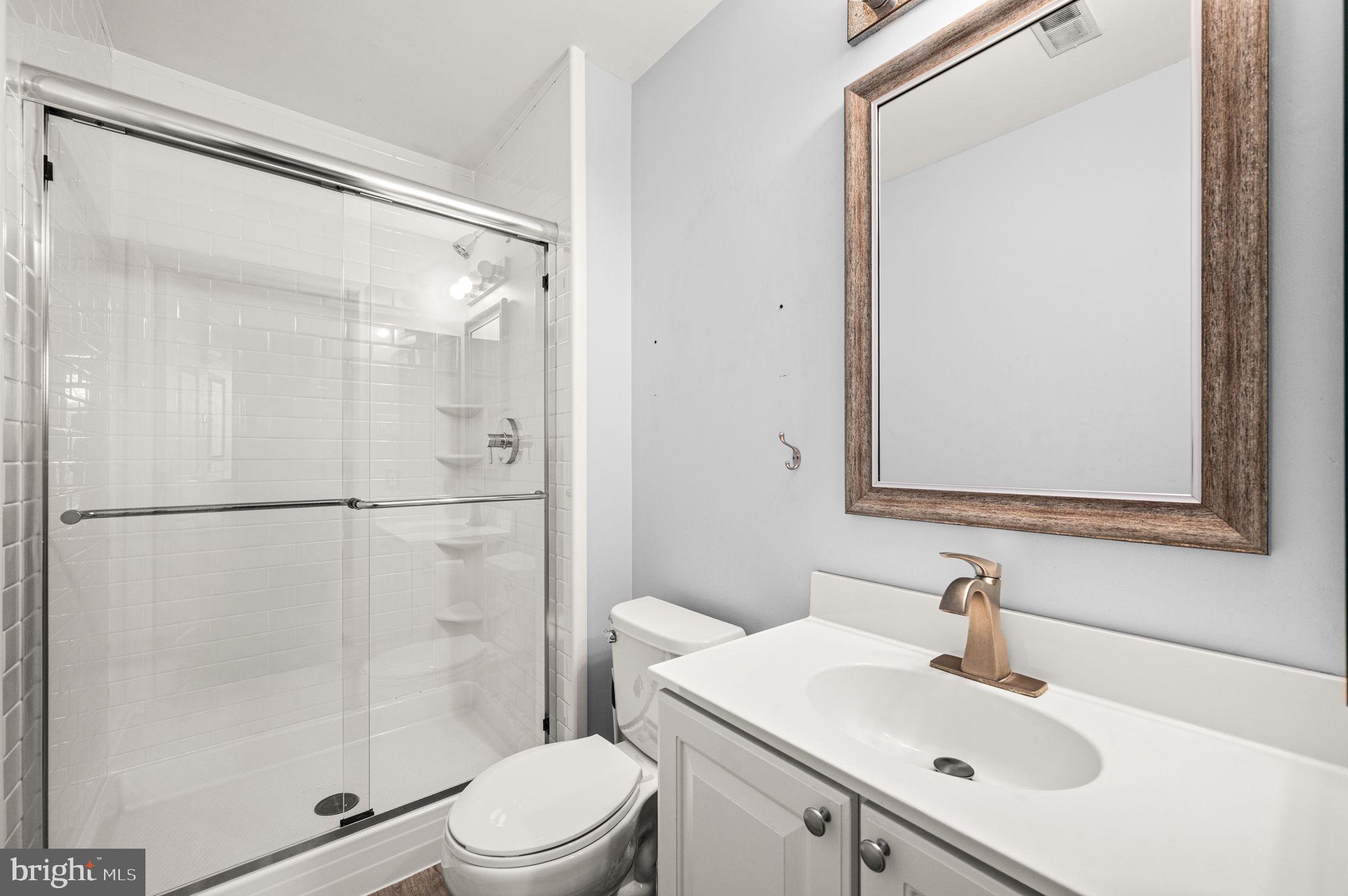 588 Coach Hill Court West Chester, PA 19380 - Photo 14 of 18 a bathroom with a sink toilet and shower