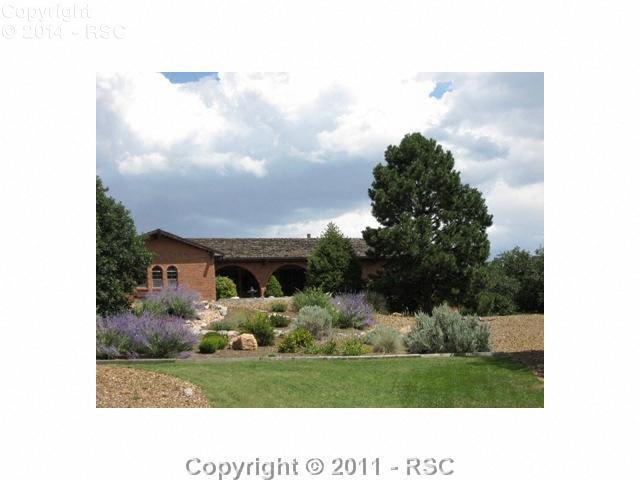 5425 Madera Road Colorado Springs, CO 80918 - Photo 1 of 11 High on your own private hill with magnificant views of the city and front range. Full brick exterior and extensive landacaping.