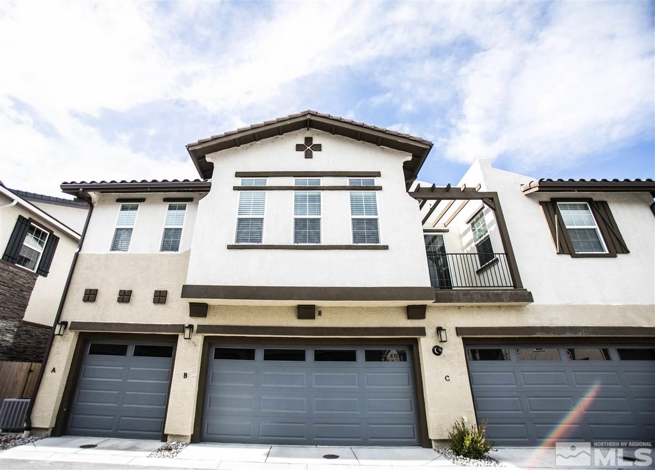 1856 Sea Horse Road, Unit A Reno, NV 89521 - Photo 1 of 16 a view of a white house with large windows