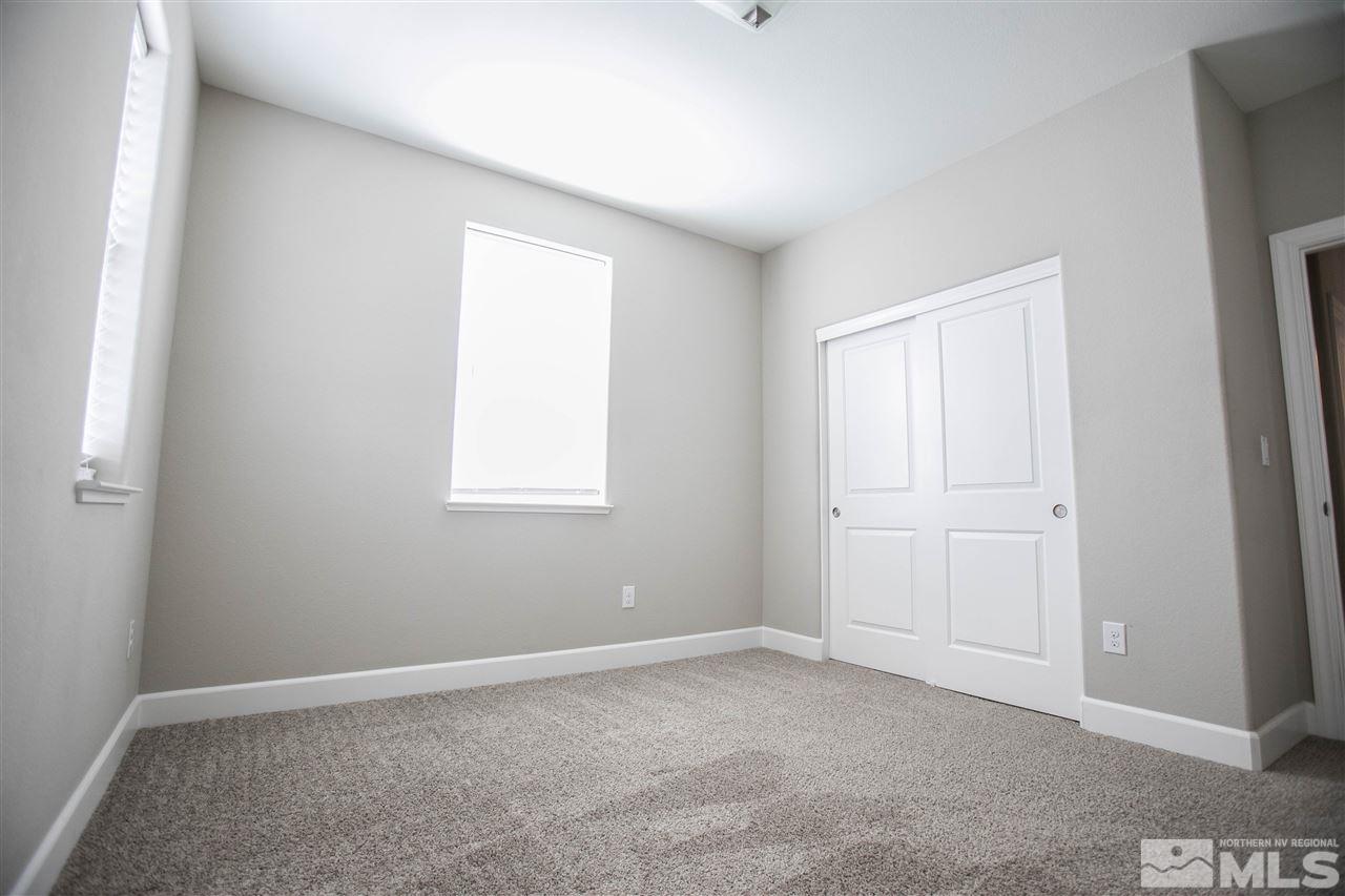1856 Sea Horse Road, Unit A Reno, NV 89521 - Photo 11 of 16 a view of an empty room with a window