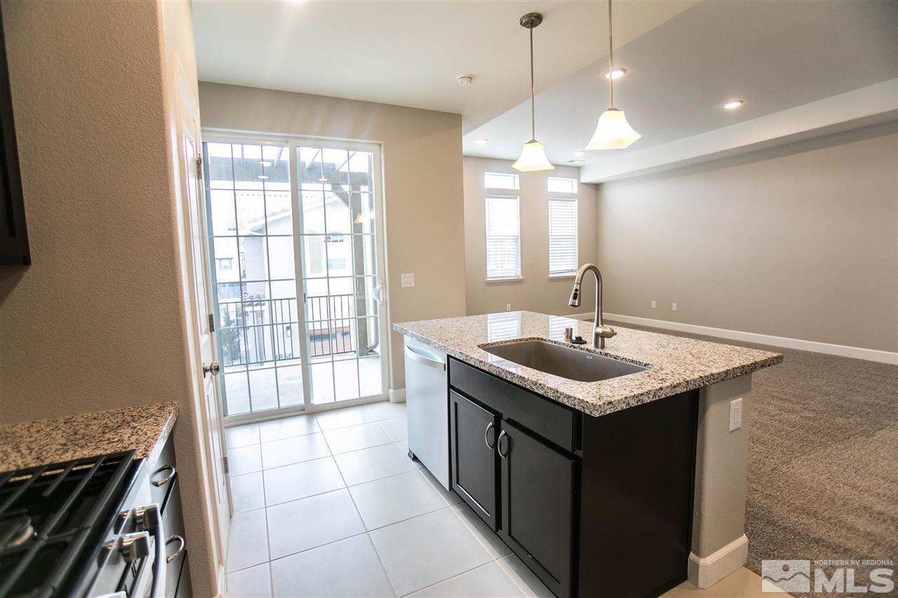 1856 Sea Horse Road, Unit A Reno, NV 89521 - Photo 8 of 16 a kitchen with a sink and a stove