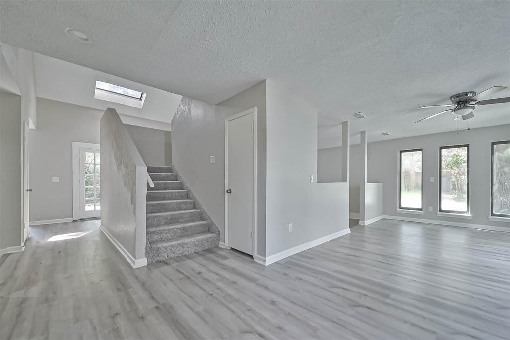 17805 Villa Way Drive Spring, TX 77379 - Photo 12 of 50 wooden floor in an empty room with a window