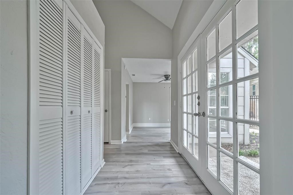 17805 Villa Way Drive Spring, TX 77379 - Photo 18 of 50 a view of a hallway with wooden floor and windows