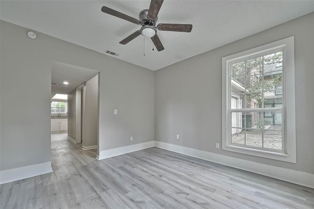 17805 Villa Way Drive Spring, TX 77379 - Photo 22 of 50 wooden floor in an empty room with a window