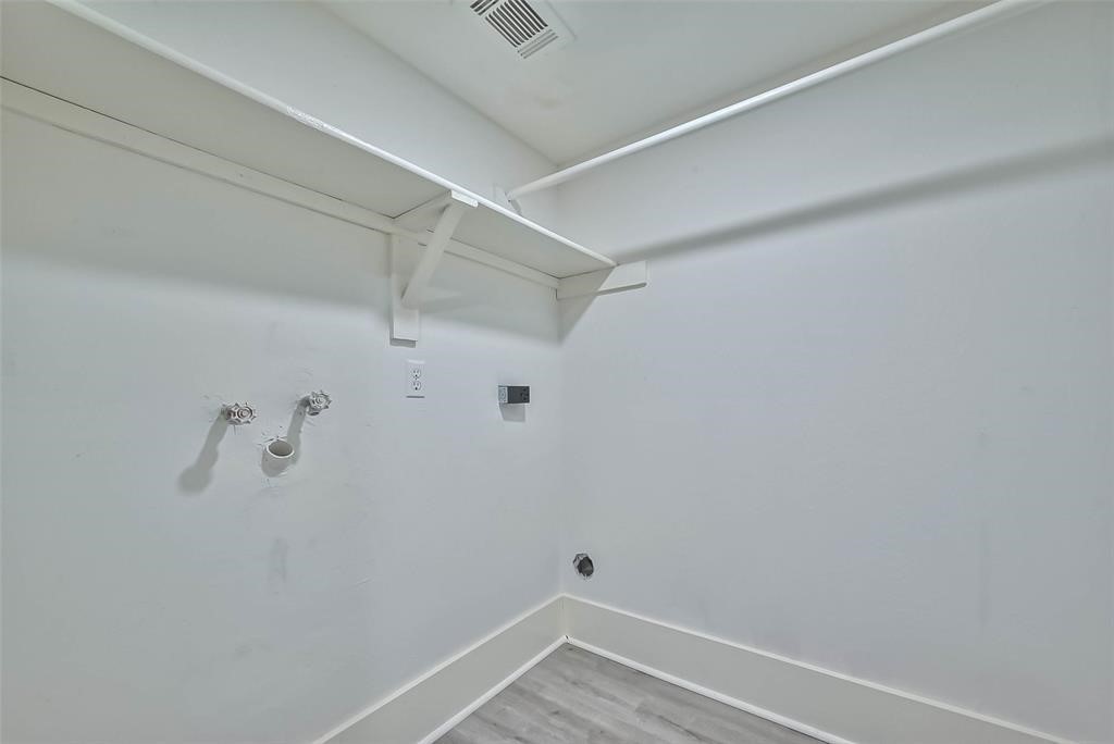 17805 Villa Way Drive Spring, TX 77379 - Photo 26 of 50 a view of a room with racks on the wall