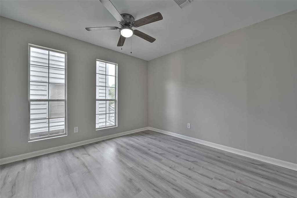 17805 Villa Way Drive Spring, TX 77379 - Photo 27 of 50 wooden floor in an empty room with a window