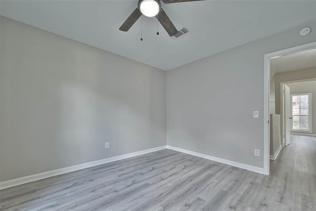 17805 Villa Way Drive Spring, TX 77379 - Photo 30 of 50 a view of an empty room with wooden floor