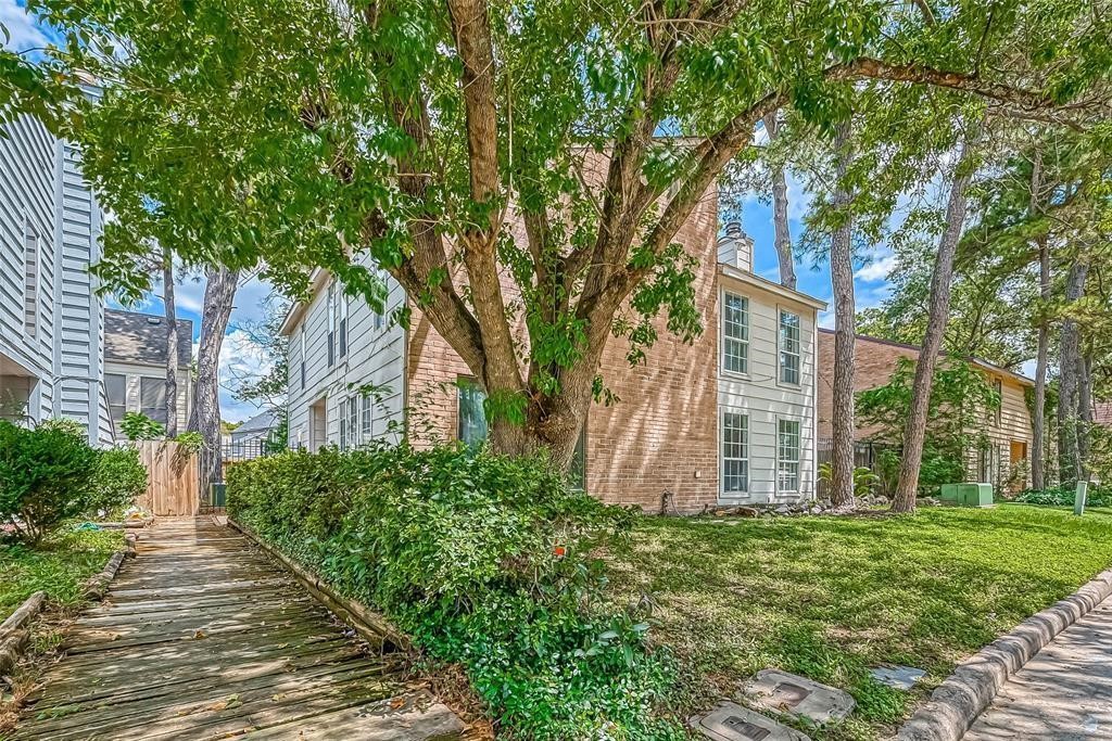 17805 Villa Way Drive Spring, TX 77379 - Photo 3 of 50 a view of a pathway both side of house