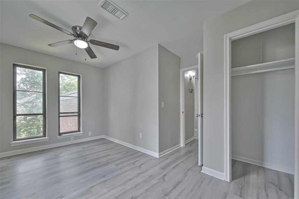 17805 Villa Way Drive Spring, TX 77379 - Photo 32 of 50 a view of an empty room with wooden floor and a window