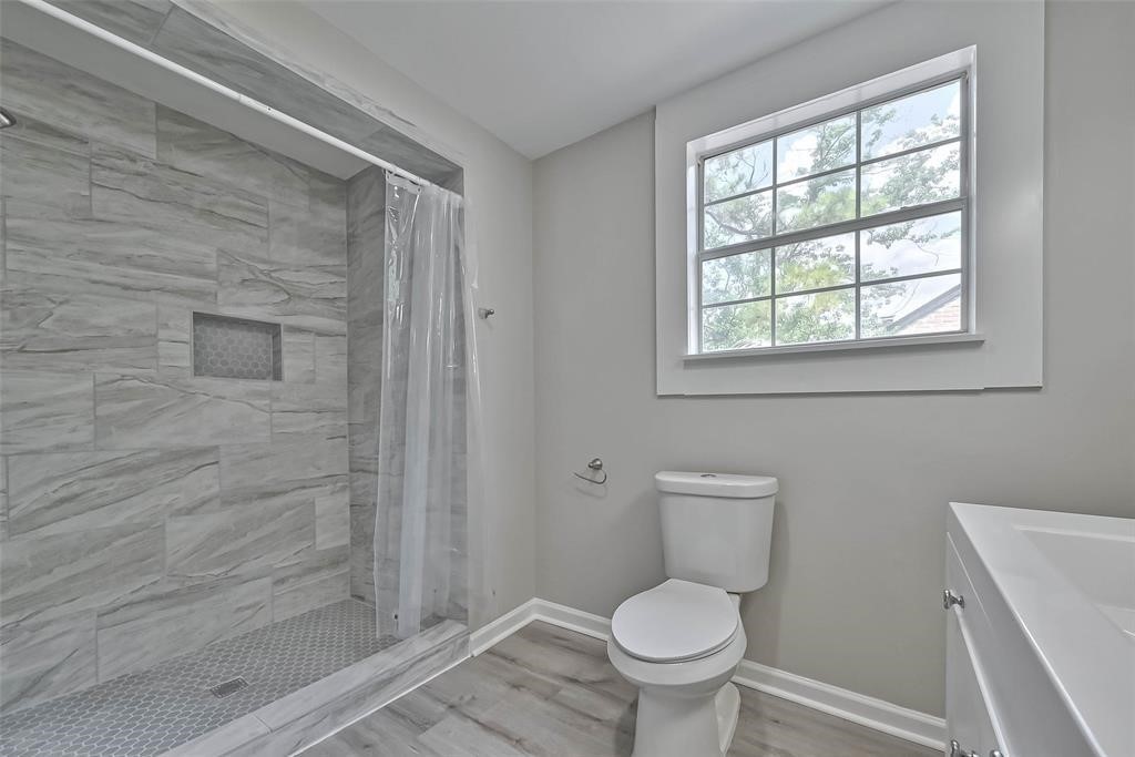 17805 Villa Way Drive Spring, TX 77379 - Photo 36 of 50 a bathroom with a toilet and a shower