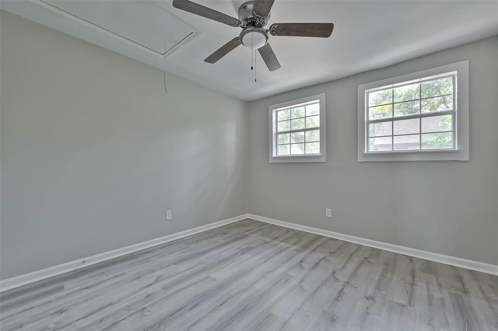 17805 Villa Way Drive Spring, TX 77379 - Photo 37 of 50 wooden floor in an empty room with a window