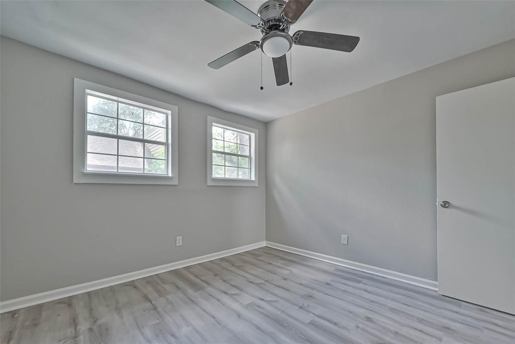 17805 Villa Way Drive Spring, TX 77379 - Photo 40 of 50 wooden floor in an empty room with a window