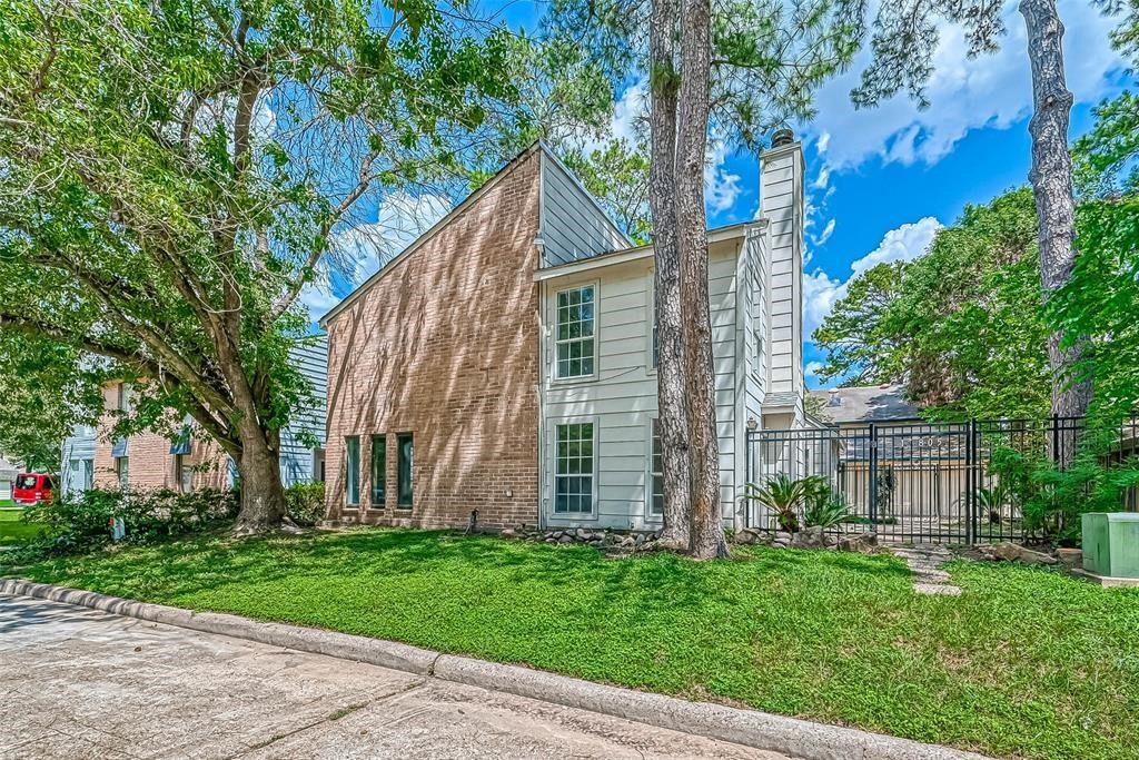 17805 Villa Way Drive Spring, TX 77379 - Photo 4 of 50 front view of a house with a yard and an trees