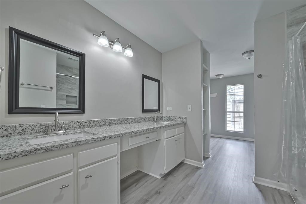 17805 Villa Way Drive Spring, TX 77379 - Photo 46 of 50 a bathroom with a granite countertop sink mirror and cabinets