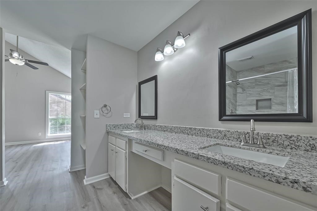 17805 Villa Way Drive Spring, TX 77379 - Photo 48 of 50 a bathroom with a granite countertop sink vanity and mirror