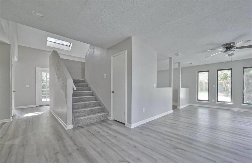 17805 Villa Way Drive Spring, TX 77379 - Photo 5 of 50 wooden floor in an empty room with a window