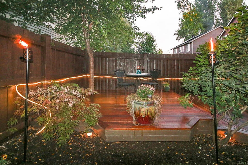 61476 Brosterhous Road Bend, OR 97702 - Photo 27 of 27 Back yard & deck picture when in bloom from previous listing.