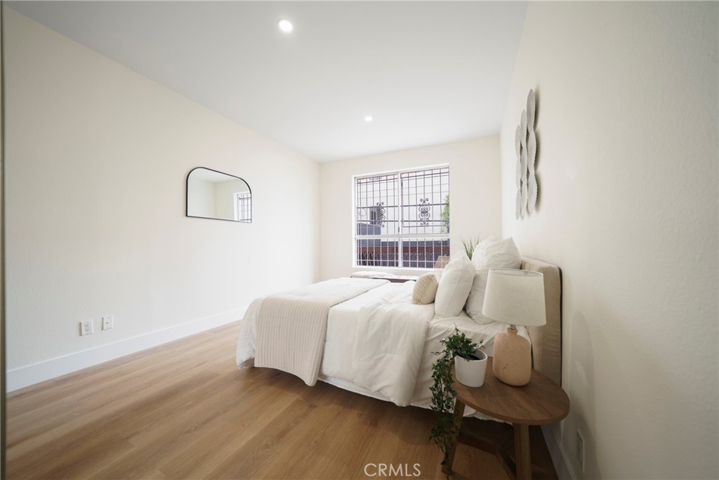 104 South Hayworth Avenue, Unit 204 Los Angeles, CA 90048 - Photo 12 of 52 a bed room with a bed and a window