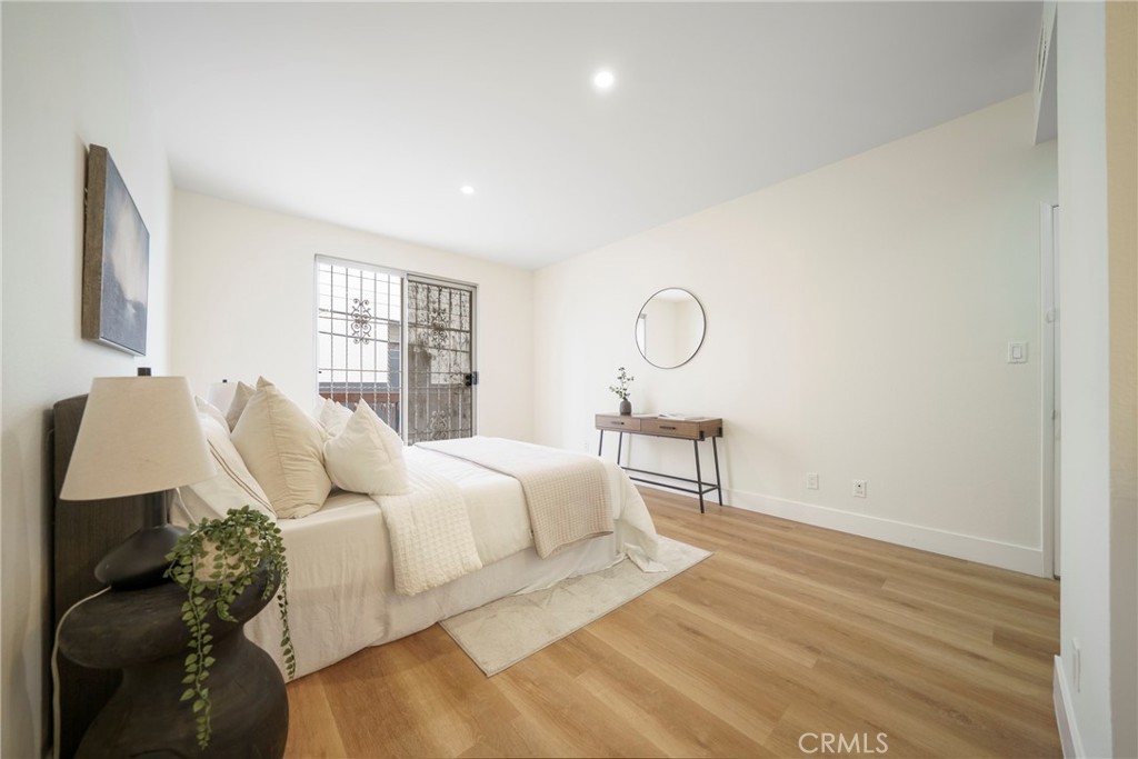 104 South Hayworth Avenue, Unit 204 Los Angeles, CA 90048 - Photo 17 of 52 a living room with furniture and a window