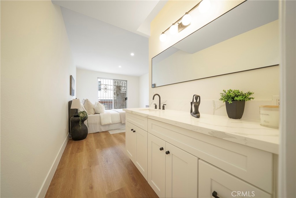 104 South Hayworth Avenue, Unit 204 Los Angeles, CA 90048 - Photo 19 of 52 a spacious bathroom with a sink
